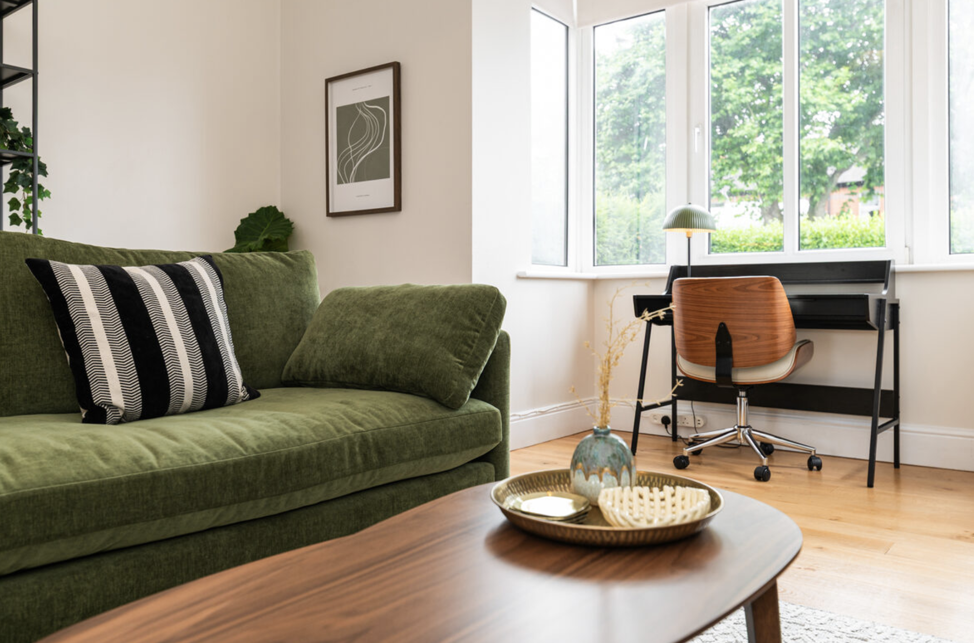 EirStay apartment with dedicated workspace and green sofa