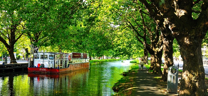 Grand Canal towpath Dublin Portobello tree-lined walking route with moored barge near EirStay corporate short-stay apartments