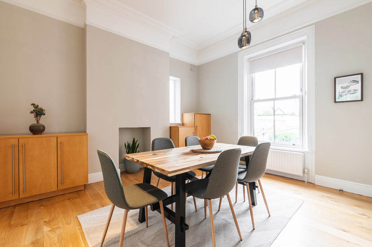 Elegant dining room with pendant lighting in EirStay corporate short stay apartment Donnybrook Dublin 4