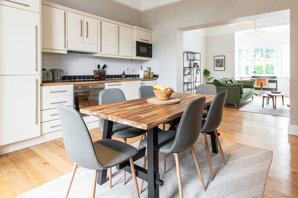 Kitchen dining area flowing into lounge in EirStay short stay corporate serviced apartment Donnybrook Dublin 4