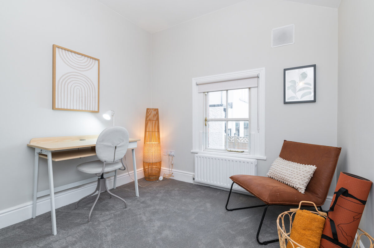 Dedicated office workspace with desk and lounge chair in EirStay corporate accommodation Morehampton Road Donnybrook Dublin 4