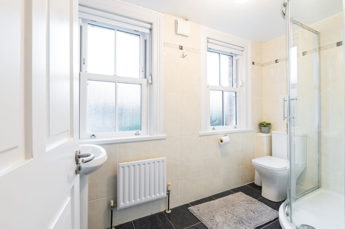Modern bathroom with walk-in shower in EirStay corporate short stay apartment Morehampton Road Donnybrook Dublin 4