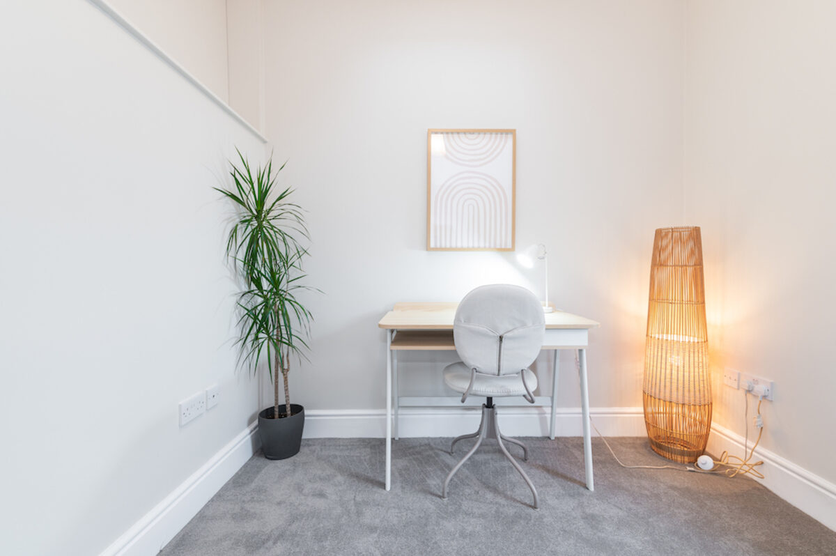Home office with desk lamp and plant in EirStay corporate short stay apartment Morehampton Road Donnybrook Dublin 4