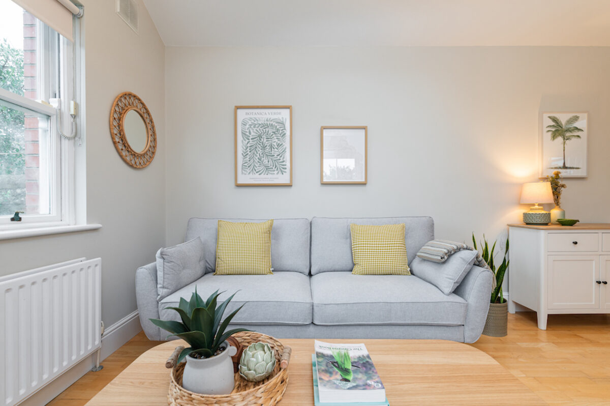 Bright living room with comfortable sofa in EirStay corporate short stay apartment Morehampton Road Donnybrook Dublin 4