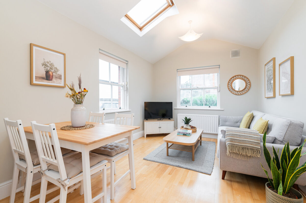 Open plan living and dining area with skylights in EirStay corporate short stay apartment Morehampton Road Donnybrook Dublin 4