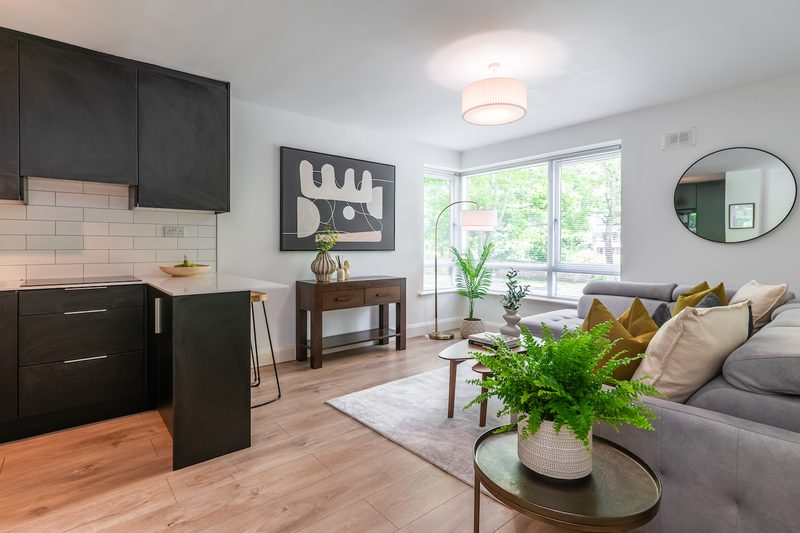 EirStay Islandbridge — one-bedroom serviced apartment on the River Liffey, Dublin 8, with open-plan living and matte-black fitted kitchen