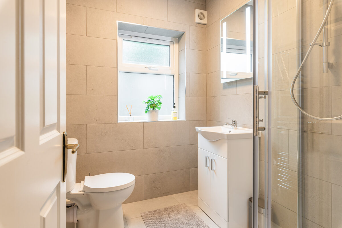Modern tiled bathroom with walk-in shower in EirStay corporate stay serviced apartment Ranelagh Dublin 6