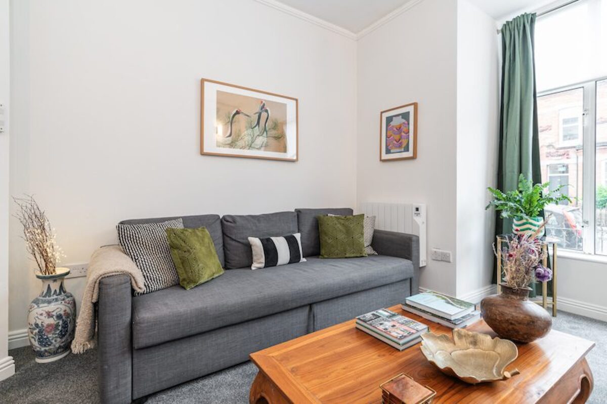 Open plan living area with sofa and coffee table in EirStay short-term accommodation Ranelagh Dublin 6